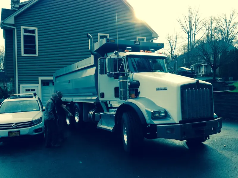 Kenworth dump truck on a freshly paved driveway