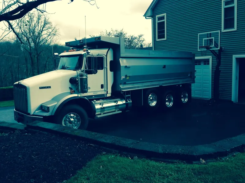 Our dump truck on a brand-new driveway by the garage