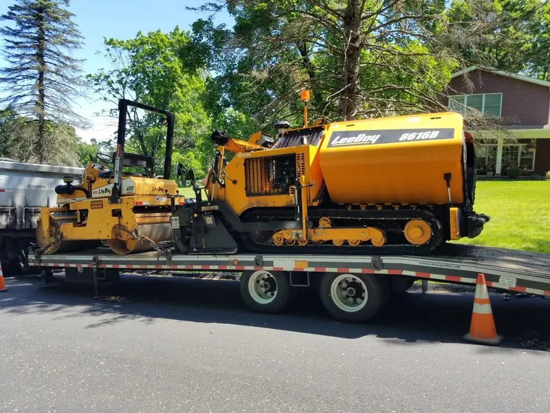 Perfection Paving trucks lined up in the yard